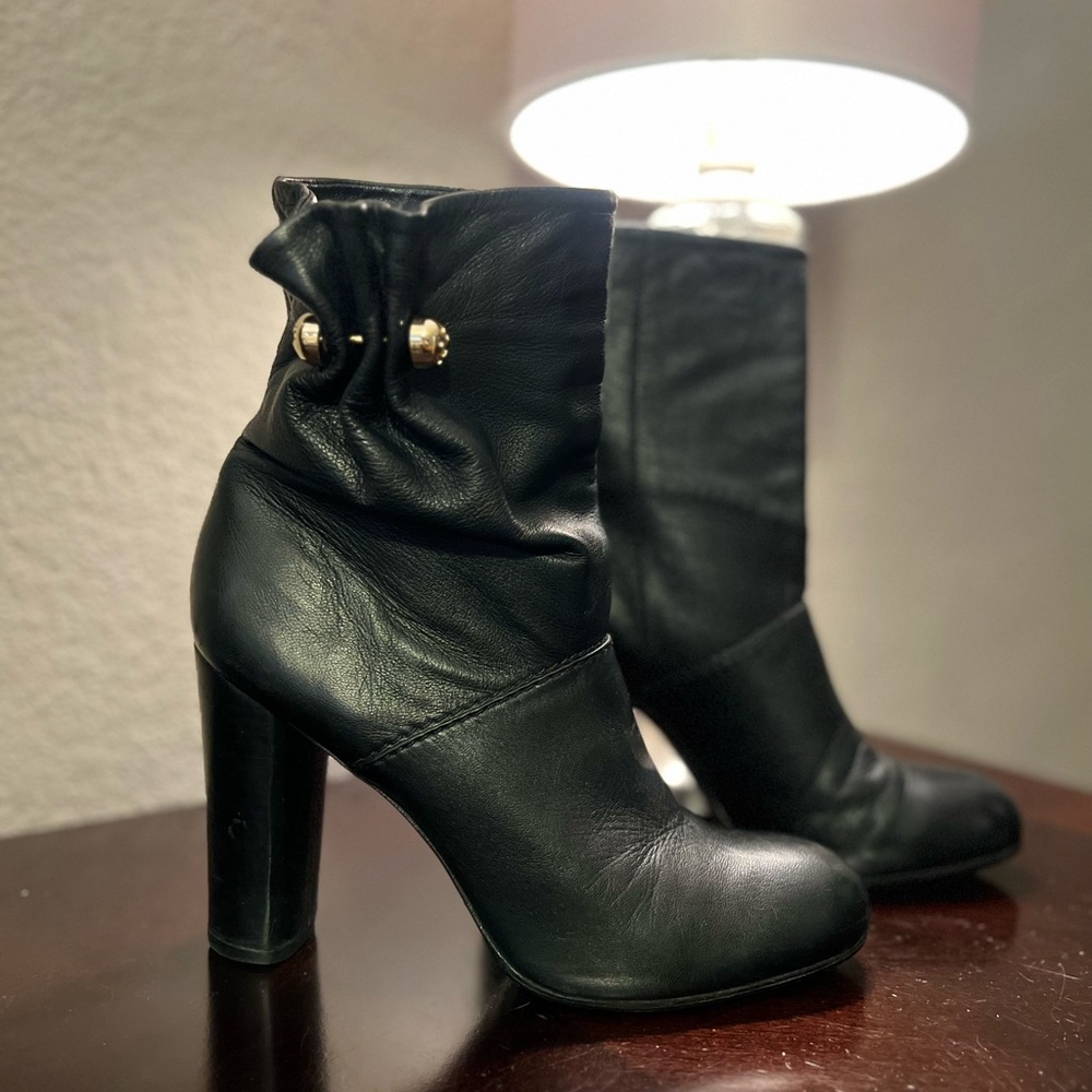 Tory Burch soft leather short black boots with gold hardware.